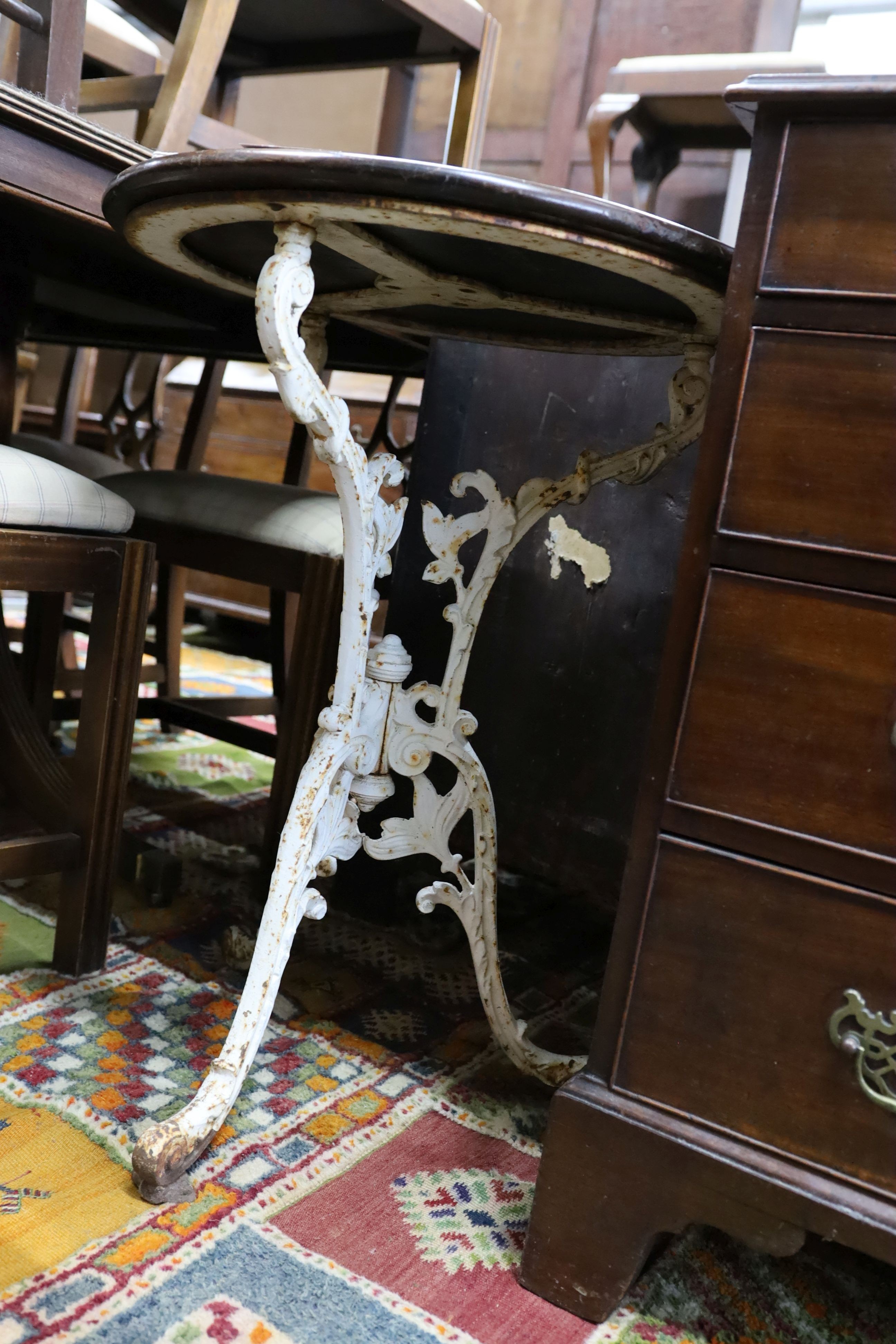 A Victorian cast iron tripod pub table with circular mahogany top, diameter 53cm, height 71cm